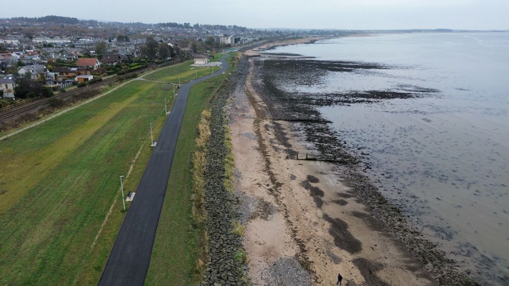 Drone shot from Barnhill Rock Gardens looking over to Monifieth. Shows coastline, beaches and River Tay estuary.