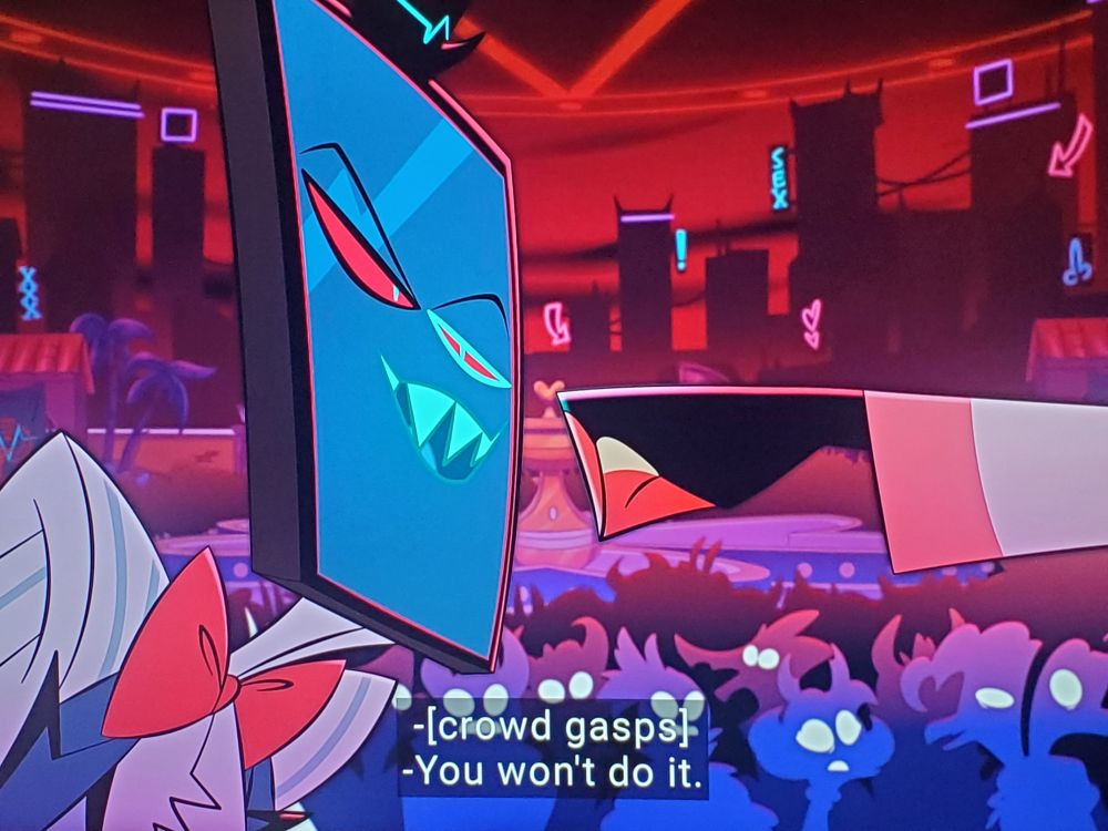 Lucifer's fist is halted right before it made contact with Vox's face. The crowd gasped.

Vox: You won't do it.