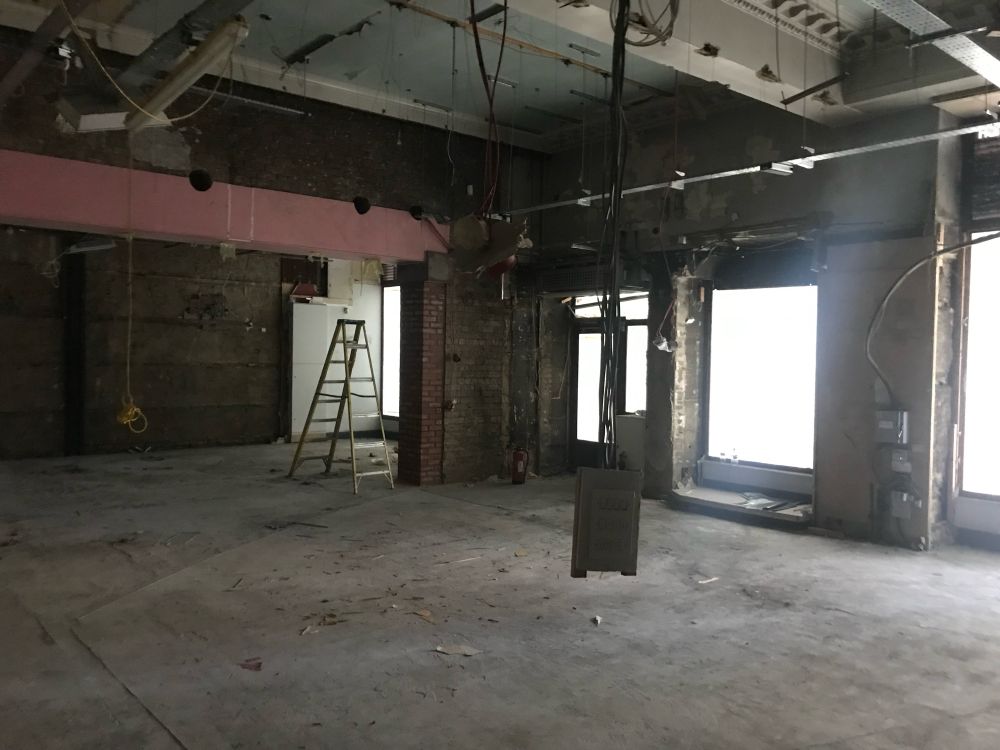 Argonaut Books, before it was Argonaut Books. A derelict unit with exposed wiring concrete.