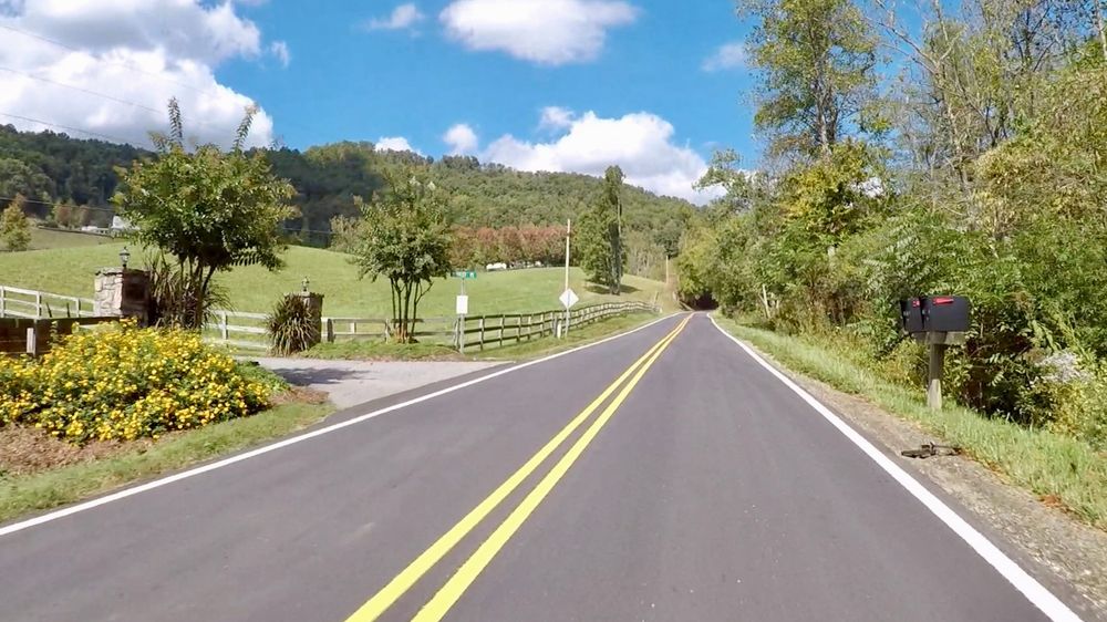 Road with small hill/mountain in the background 