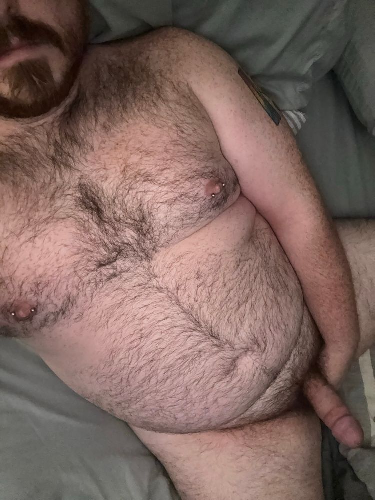 Me lying in bed while holding my hard dick