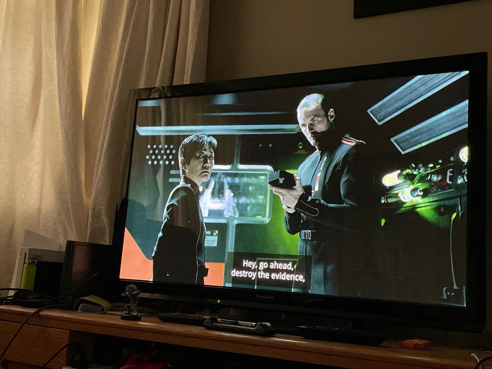 A screenshot from the Expanse season 1 episode 3, showing two MCRN officer looking towards the camera
