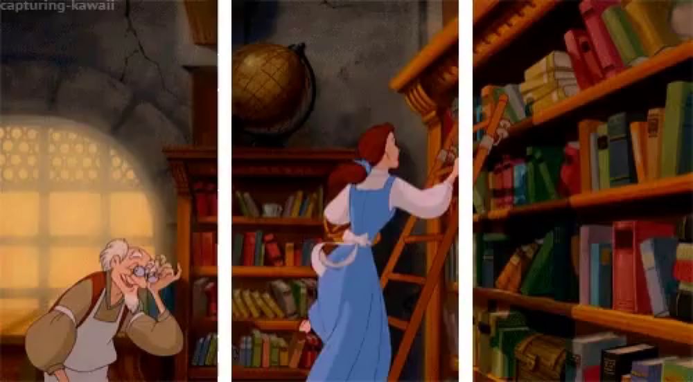 a woman in a blue dress is standing in front of a bookshelf