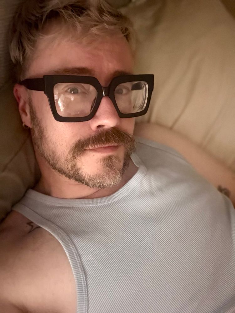 Me in blue vest and looking at the camera 