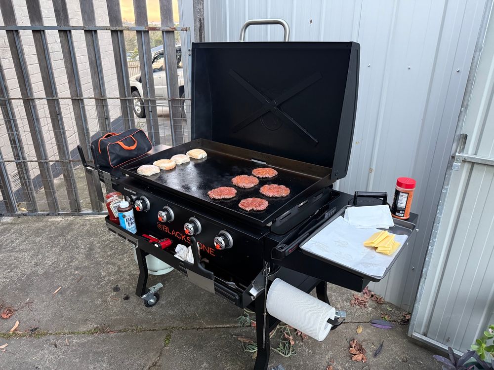 Smashburgers cooking on a Blackstone griddle