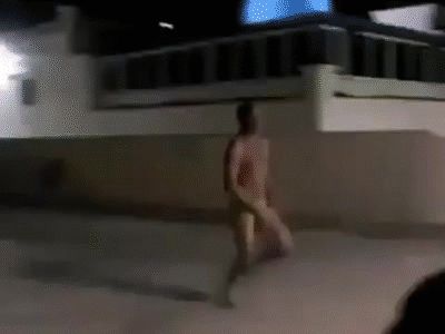 Naked man runs into sports court glass door 