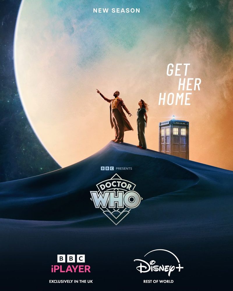 The Doctor Who Season 2/Series 15 Poster: The Doctor and his new companion Belinda Chandra standing on a Dune at night, looking at the stars. The doctor pointing at something at the sky, while a giant moon glows behind them. The Tardis can also be seen in the back, slightly behind that dune. "Get Her Home" is written above it. 
