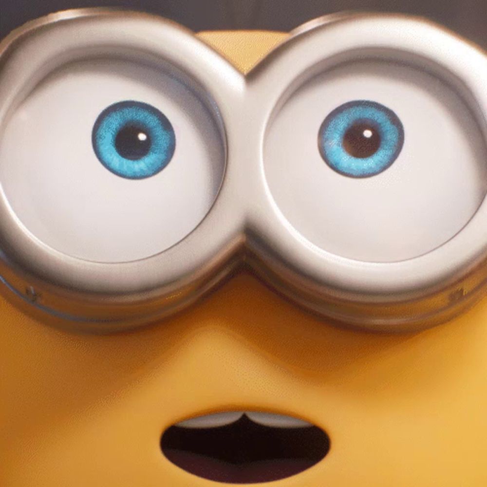 a close up of a minion 's blue eyes