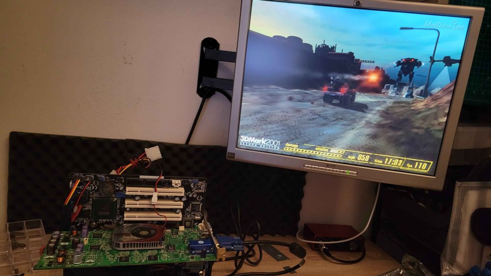 Leadtek A250 Ultra (GeForce4 Ti4600) with a temporary replacement cooler plugged into an open test bench and running 3DMark2001SE