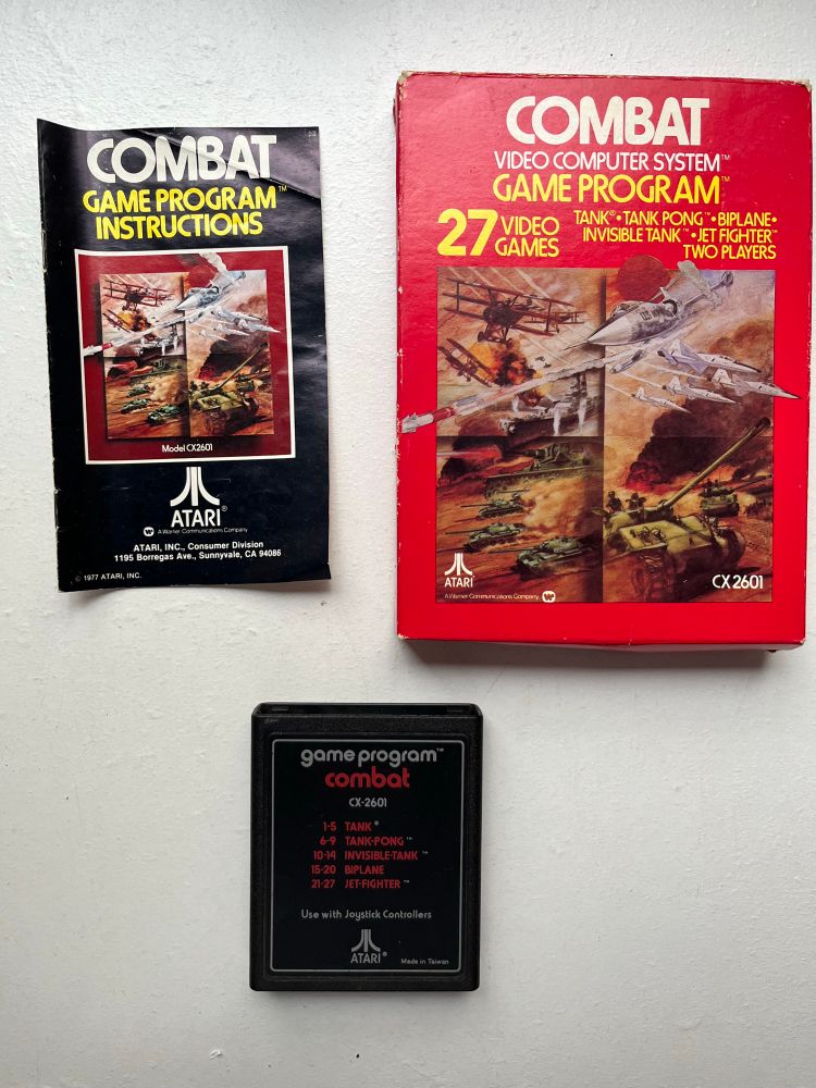 Box, cartridge, and manual for the Atari 2600 game: Combat