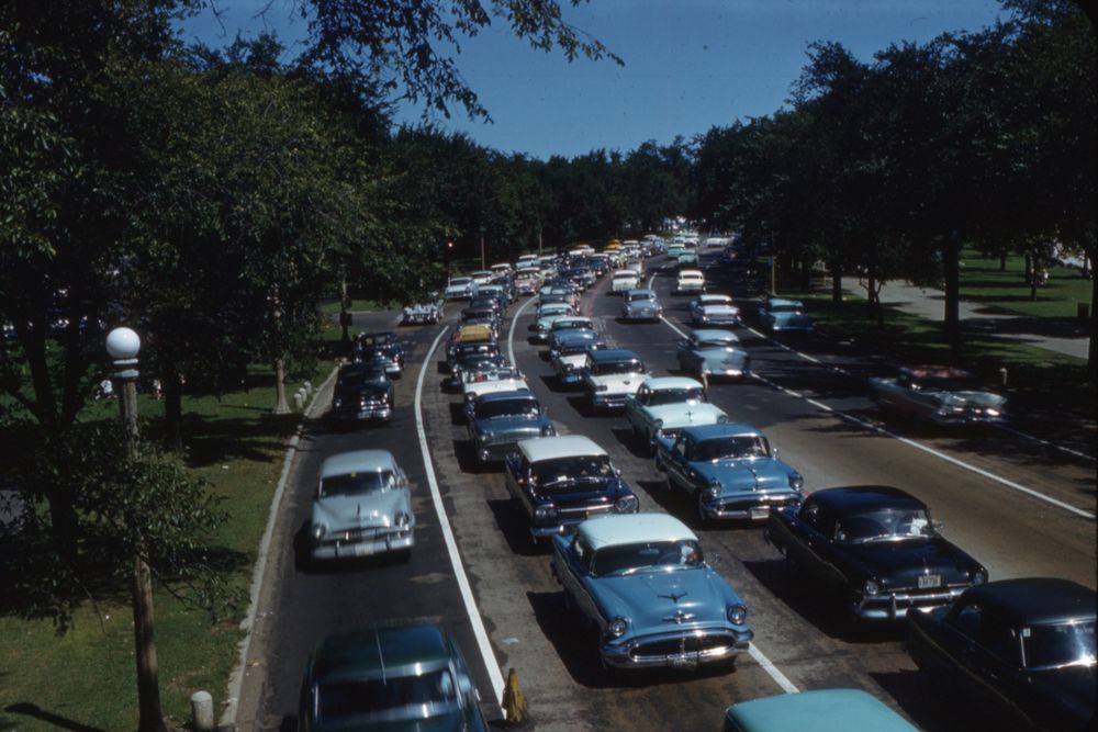 An old picture of cars stuck in traffic.