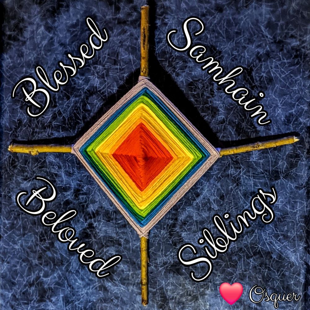 A rainbow god's eye with the text "Blessed Samhain, Beloved Siblings"