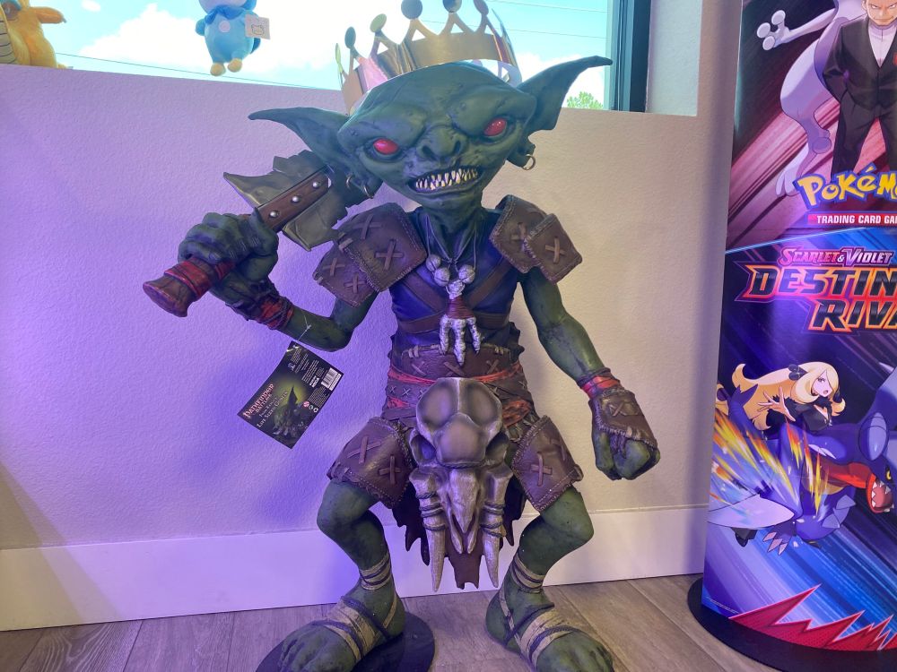 GOBLIN 👹 GREEN GOBLINN HE HOMDING A SWORD AND HAS AN EPIC CROWN AND BONE ARMOR AND HIS TOES R OUT