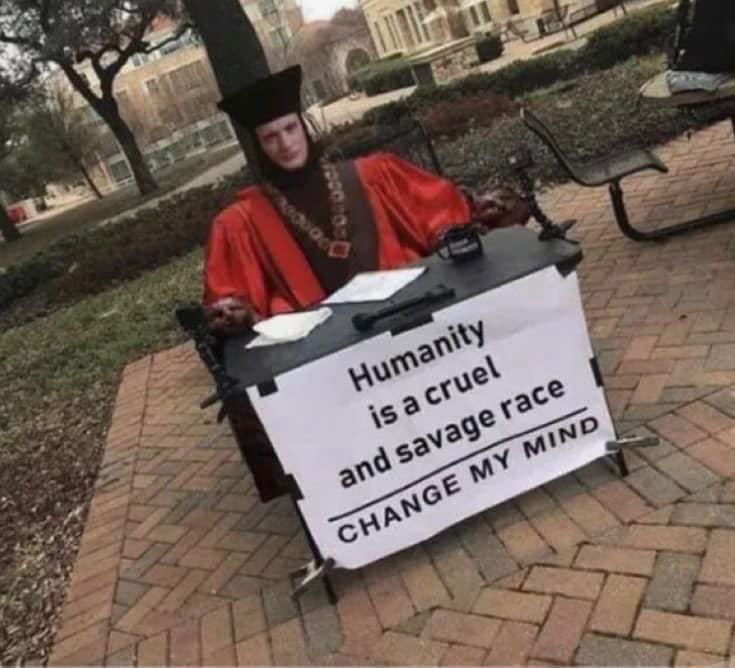 Q from star trek sitting behind a table that says

humanity is a cruel and savage race, change my mind