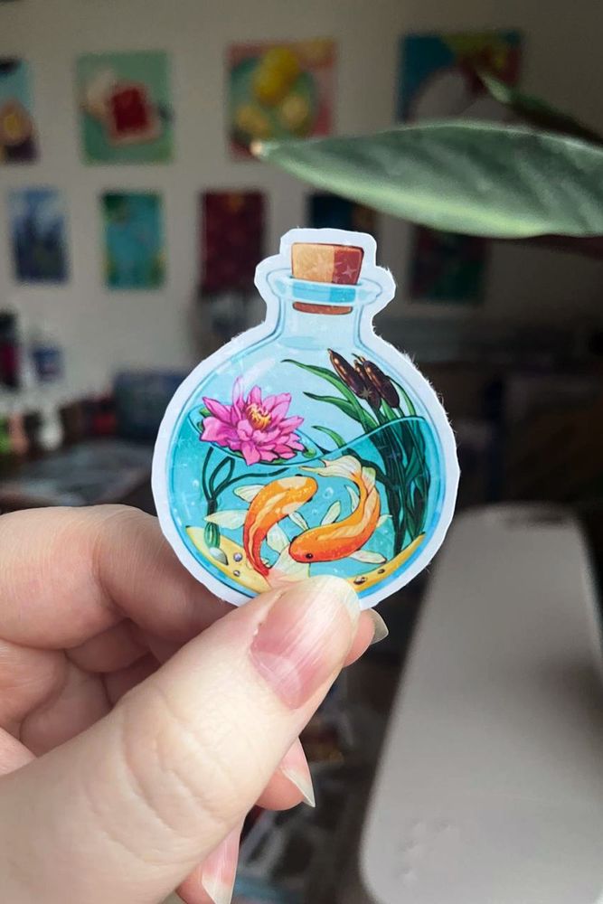 Potion of Water Breathing sticker with a small magical pond and goldfishies in it.