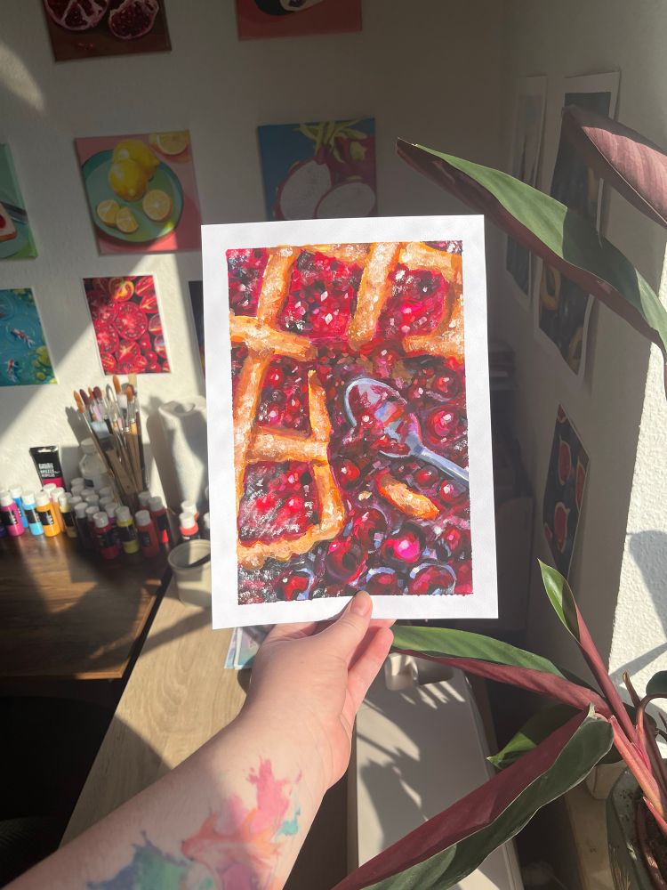 A photo of an acrylic painting of a cherry pie with leaking filling and a spoon