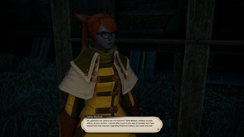 A screenshot of Tahla Mohkoh, a female keeper of the moon with blue/gray skin and dark orange hair. There is a dialogue box that reads "Ah, goodness me, where are my manners? Tahla Molkoh, military records officer, at your service. I cannot offer much in the way of combat, but if you should have any inquiries regarding historical matters, you need only ask!"