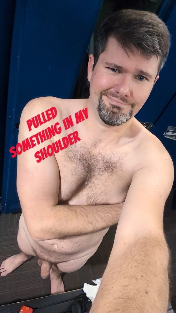 Sean looking sad and pained while naked in the gym locker room.