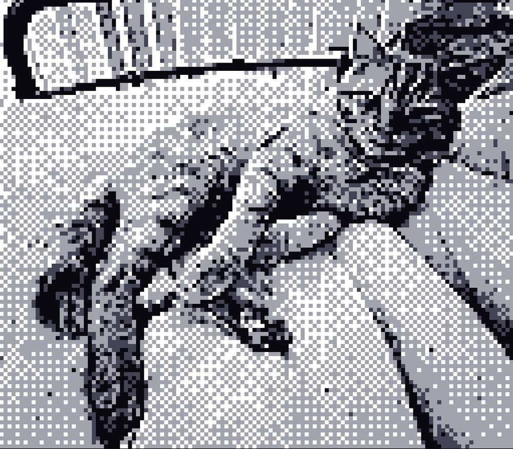 Jones the cat. Pictured in Black & White. 128x128 pixel. Taken with a Gameboy Colour