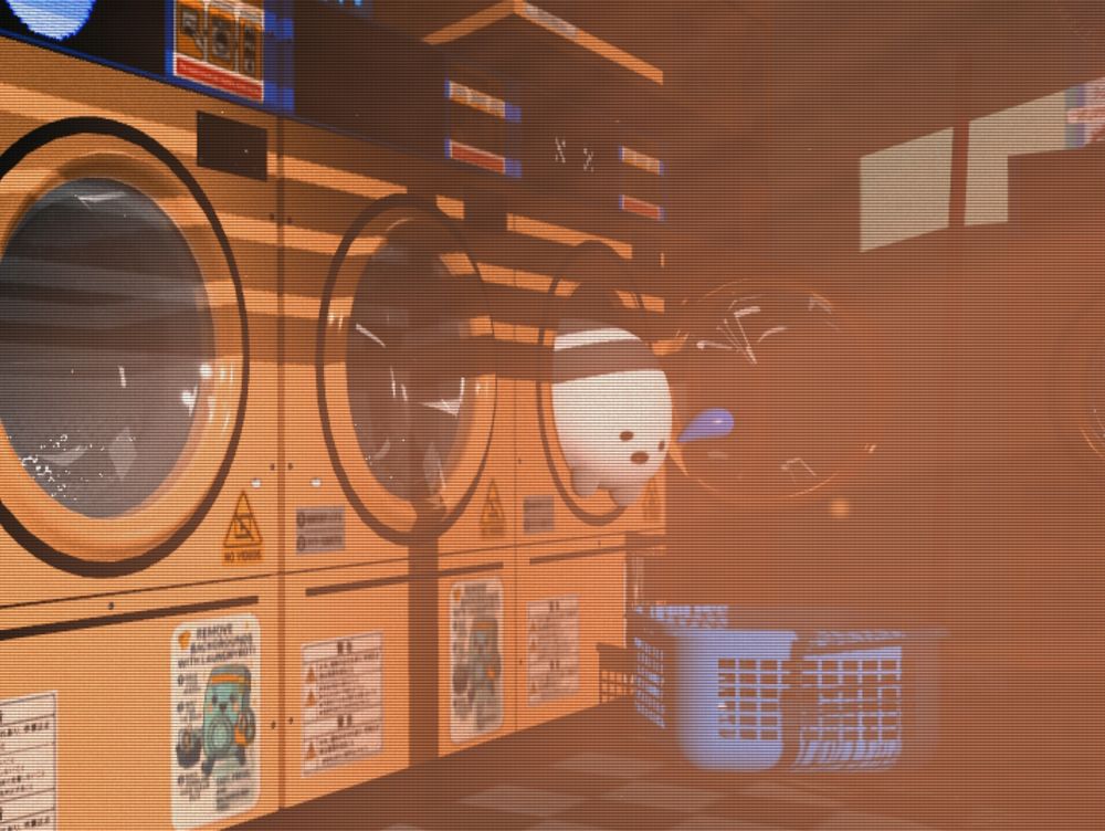 A funny blob hanging out of a washing machine. 