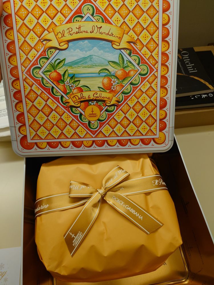 A Dolce & Gabbana panettone in a metal box.