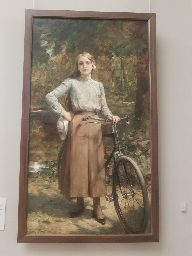 Gemälde einer Fraumit langrm Rovk & Fahrrad