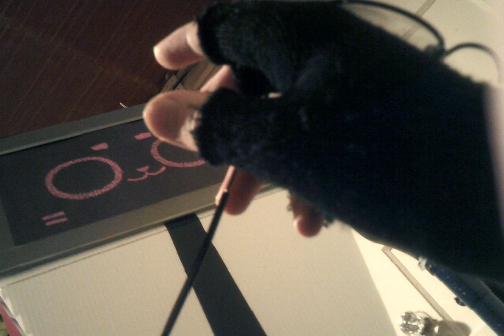 my hand holding my glasses. im on the ground and kerfur is looking down unhelpfully