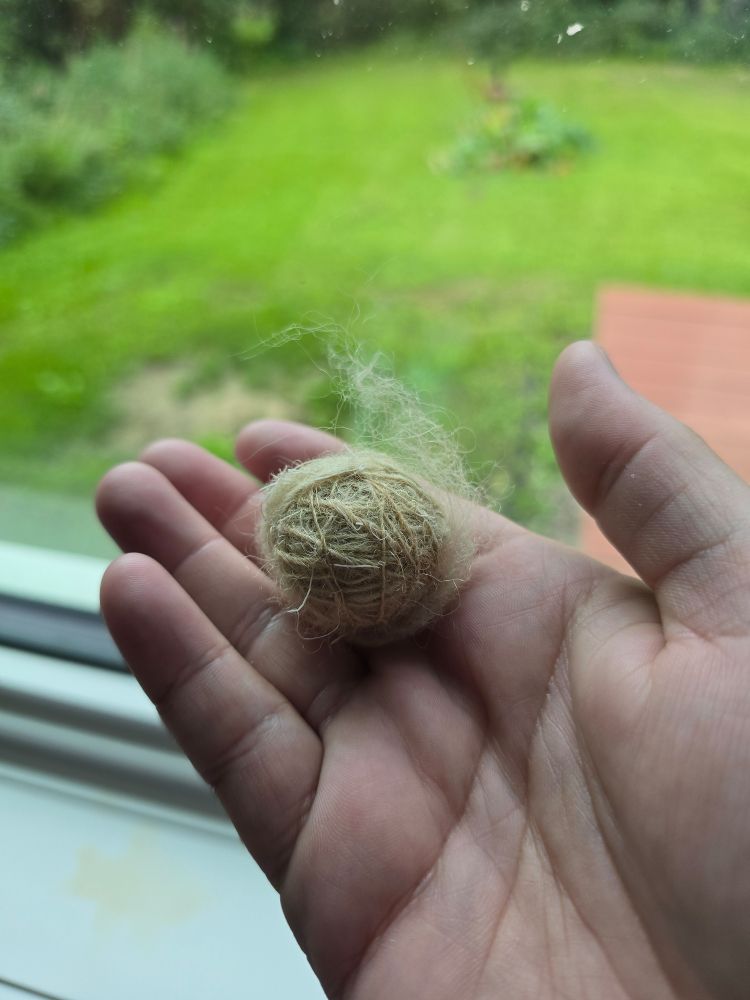 A small center-pull ball of caribou yarn