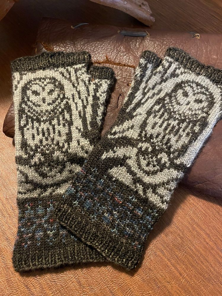Varia Mitt backs featuring an owl on a branch in brown, oatmeal and variegated blue green with a scrolling border.