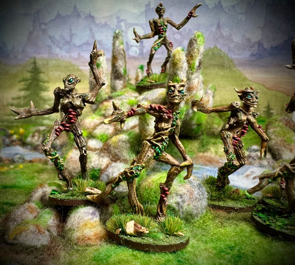 
Painted Dryad miniatures on needle felted terrain with a painted background. 