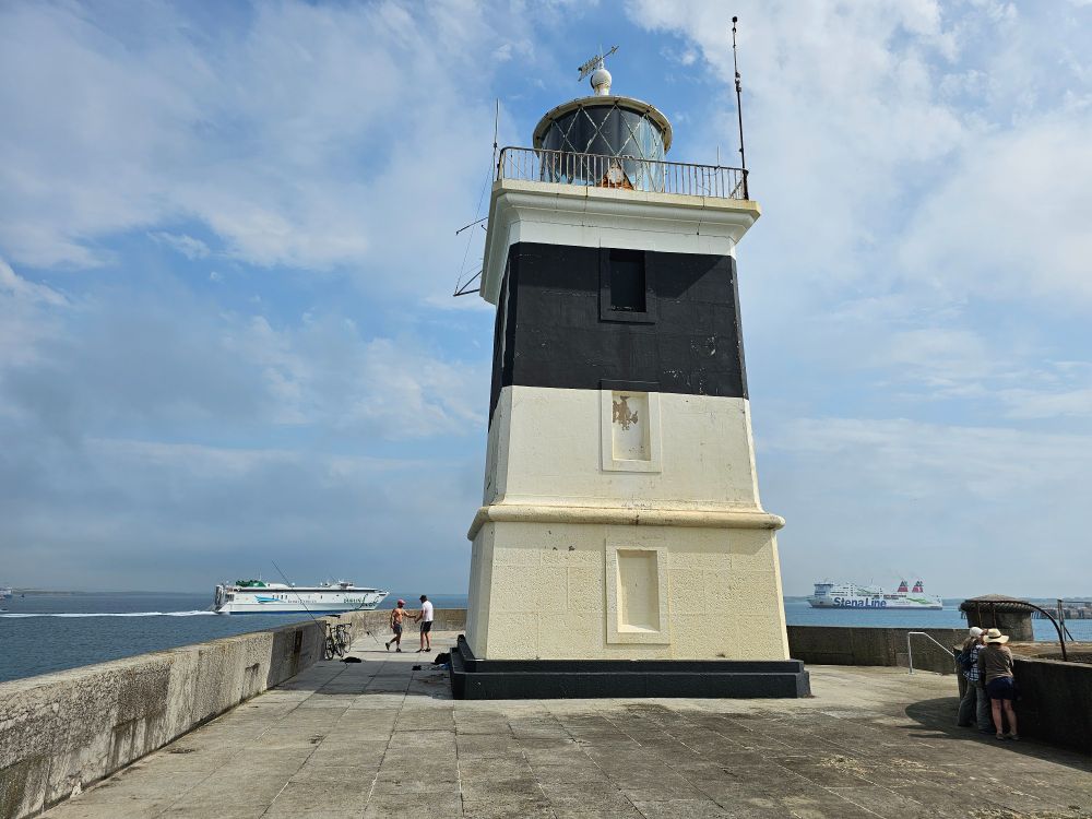 Holyhead Breakwater lighthouse, with two ferries approaching
