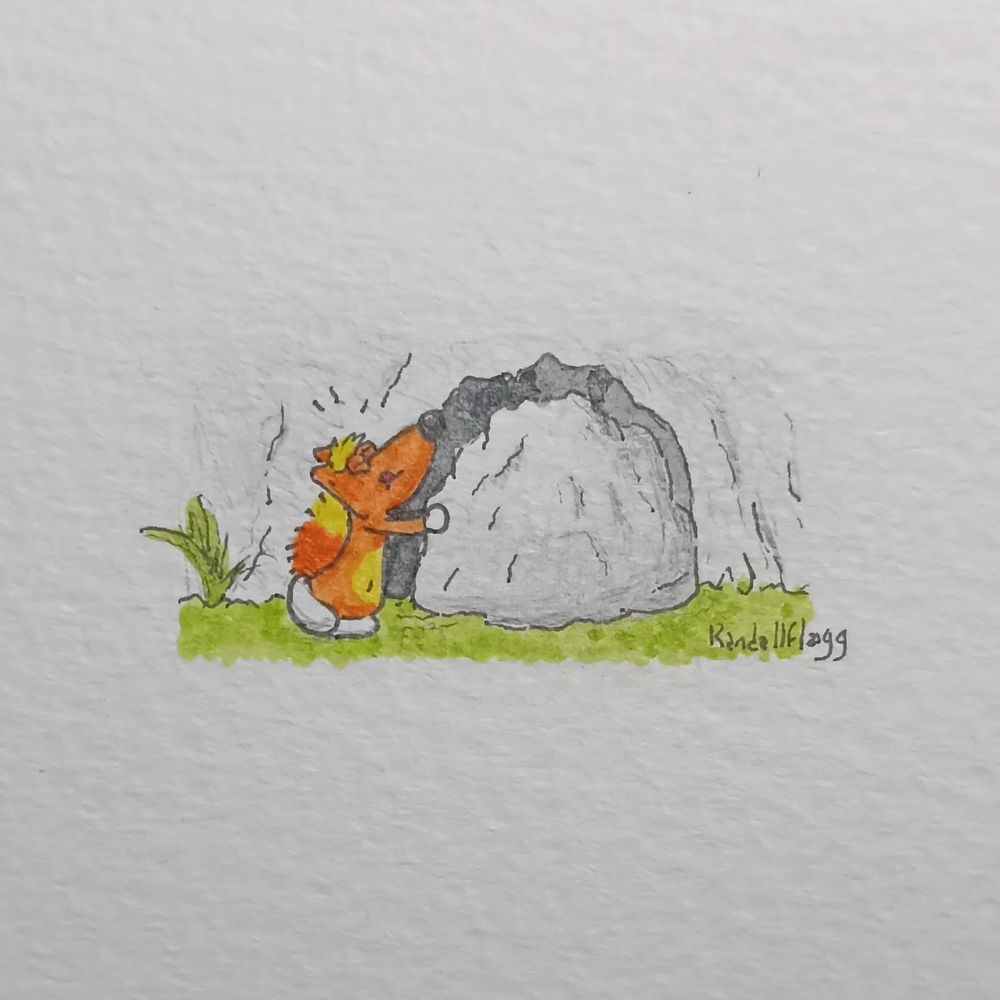 Notre musclé héro pousse un gros rocher qui obstrue le passage vers une grotte