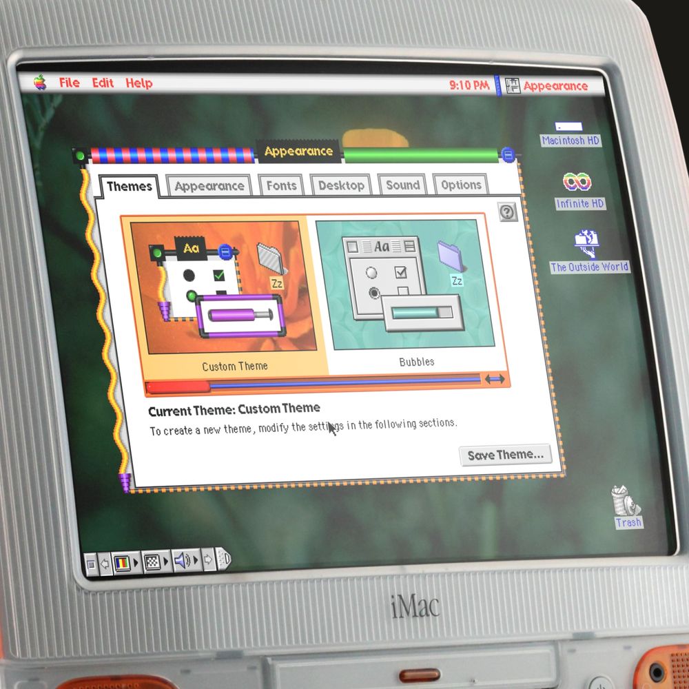 A screenshot of Mac OS 8.5, shown on an orange iMac. A colourful clown like theme is applied to the OS.