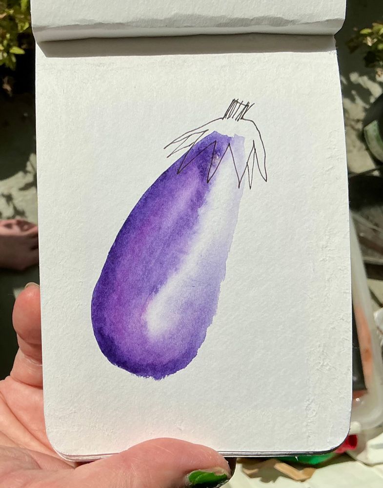 An eggplant in purple with a top in line ink in watercolor on A6 paper