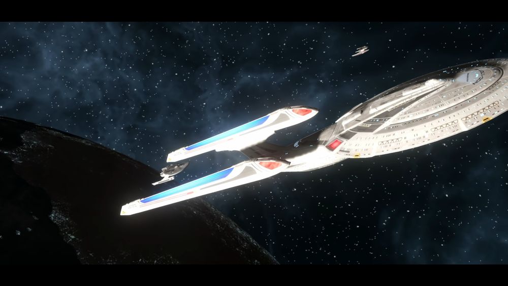The Enterprise-E, flanked by several Sector-001 era starships.