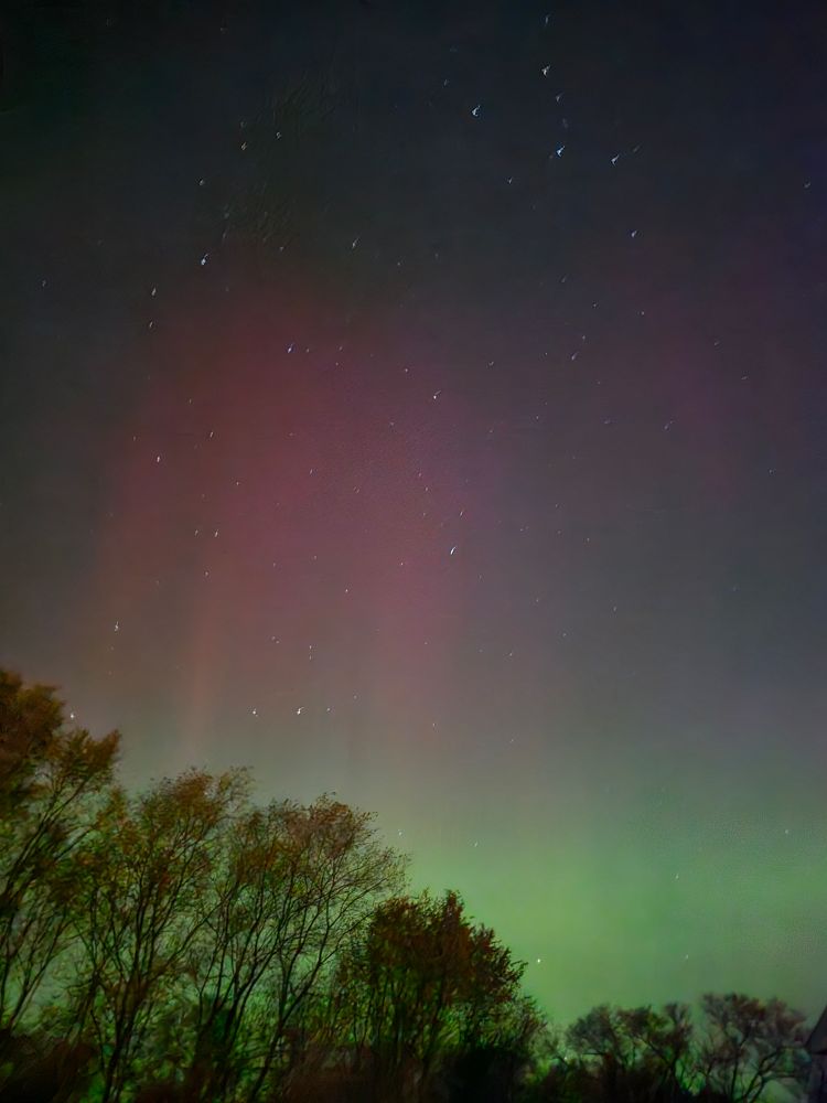 Freaky sky light show going on at man's home. Potential radio wave alien fugitive wolfy dog creature sighted merging with depressed human. More pics at 11...