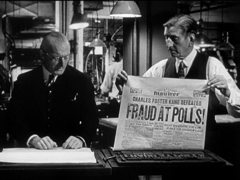 Image from Citizen Kane with Everett Sloane choosing the Fraud at Polls! headline even though he knows it’s not true.