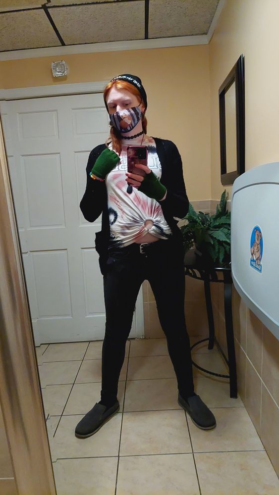 a bathroom selfie of me [Daria], taken in a restaurant bathroom with an unusually large unmounted full-length mirror