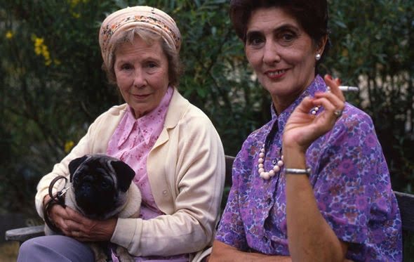 Ethel & Dot from EastEnders. Ethel is holding her Willy (pug).