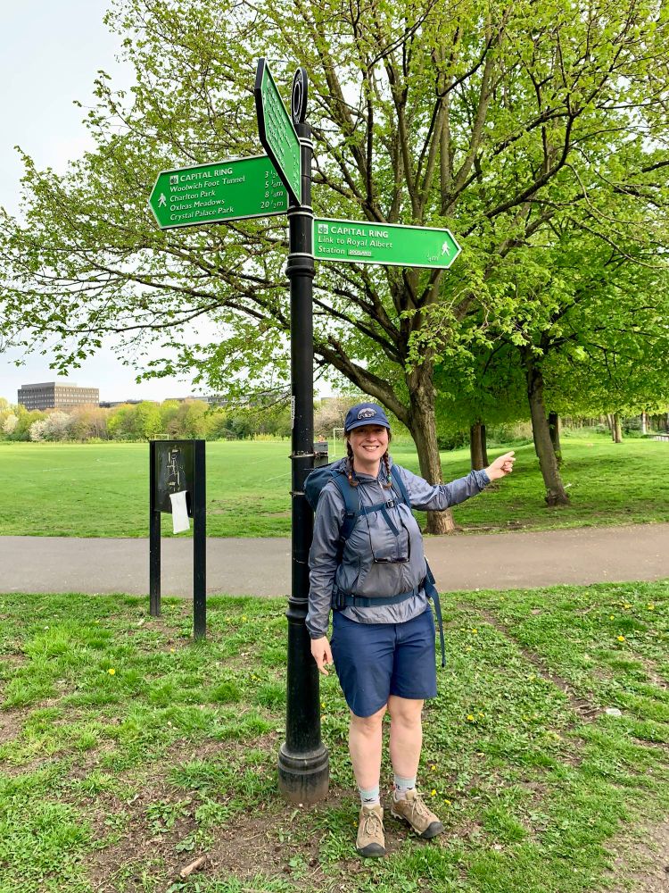 Me pointing at a Capital Ring fingerpost 