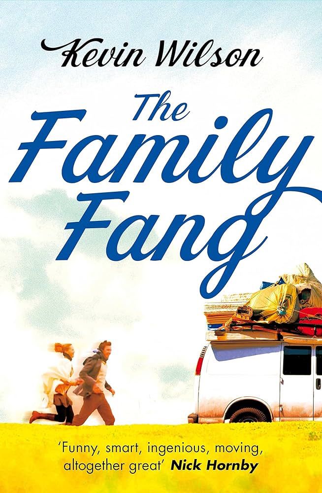 Cover of The Family Fang, by Kevin Wilson. This edition features two people running behind a white van. The van’s roof is stacked with luggage and boxes. 