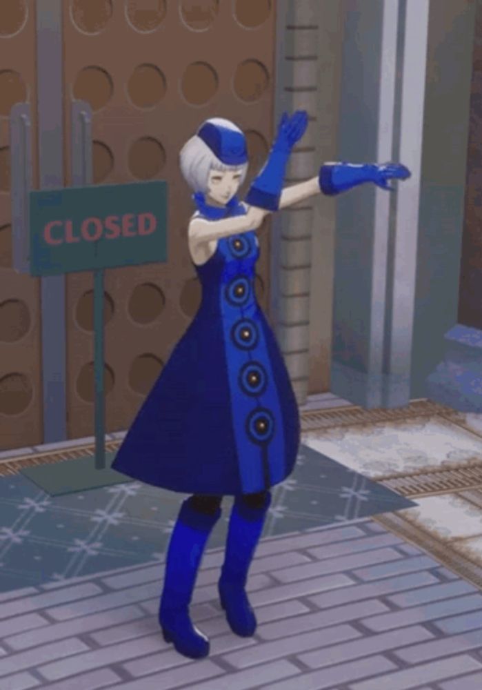 a woman in a blue dress is standing in front of a closed sign