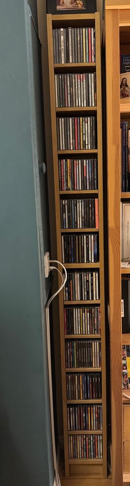 A shelf with cd albums