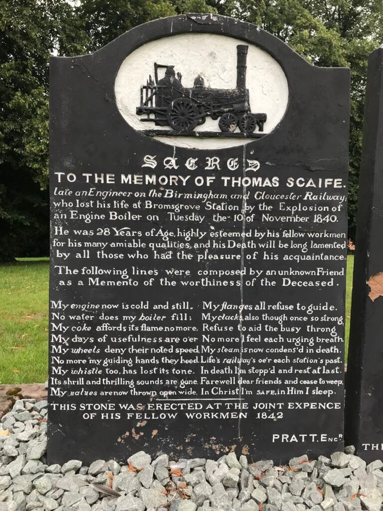 Elaborate headstones for Thomas Scaife and Joseph Rutherford, killed following the explosion of the boiler of the train they were driving, in Bromsgrove on 10 November 1840. Black faced with white text, poems on both, and images of a railway engine at the top of both.