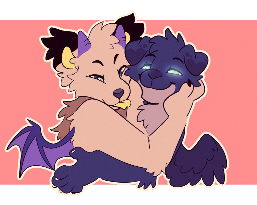 Mae holding Sage’s face as they both smile at the viewer