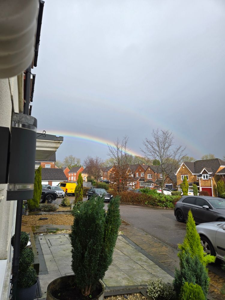 Double rainbow over houses. 