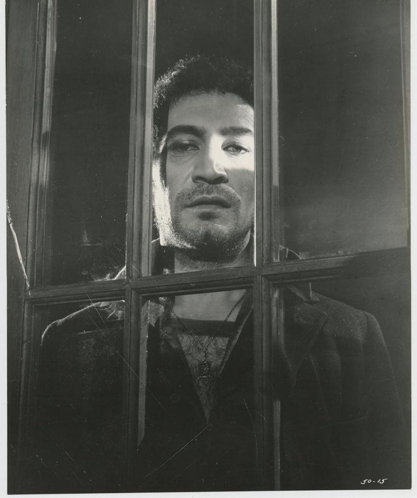 Shot from The Innocents of Peter Wyngarde at a window.