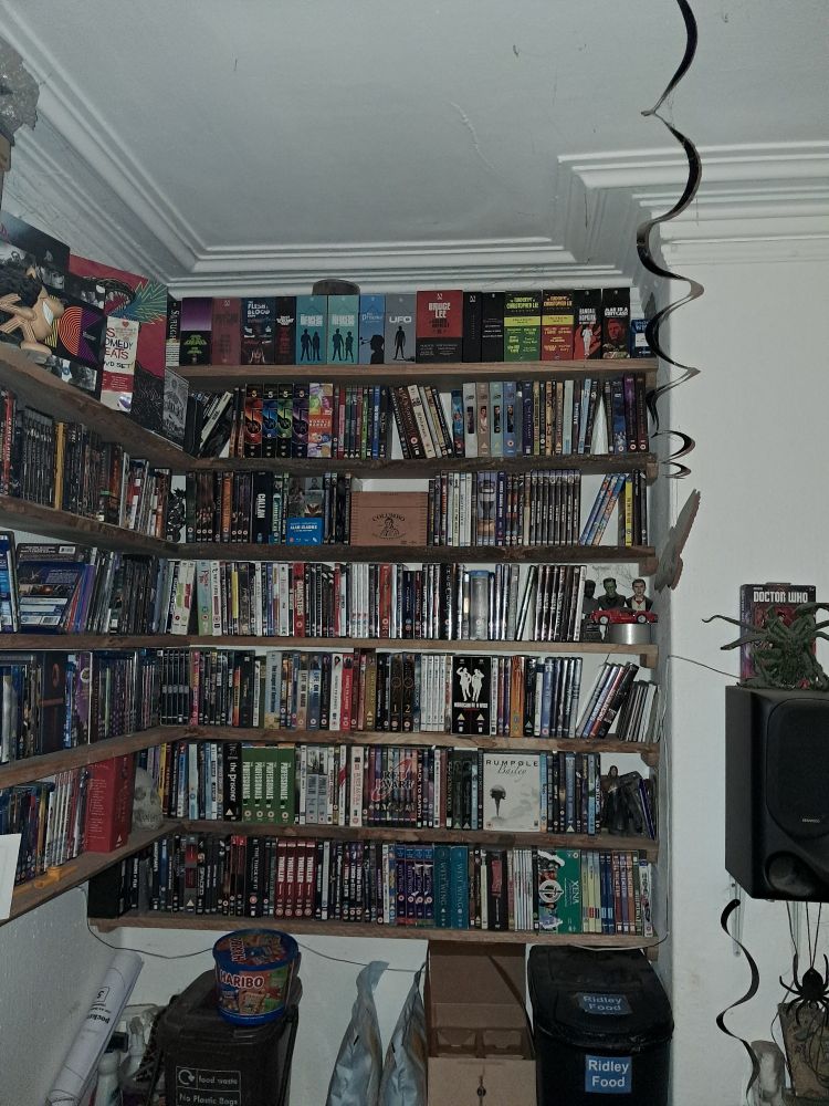 Shelves crammed with dvds and blu-rays 
