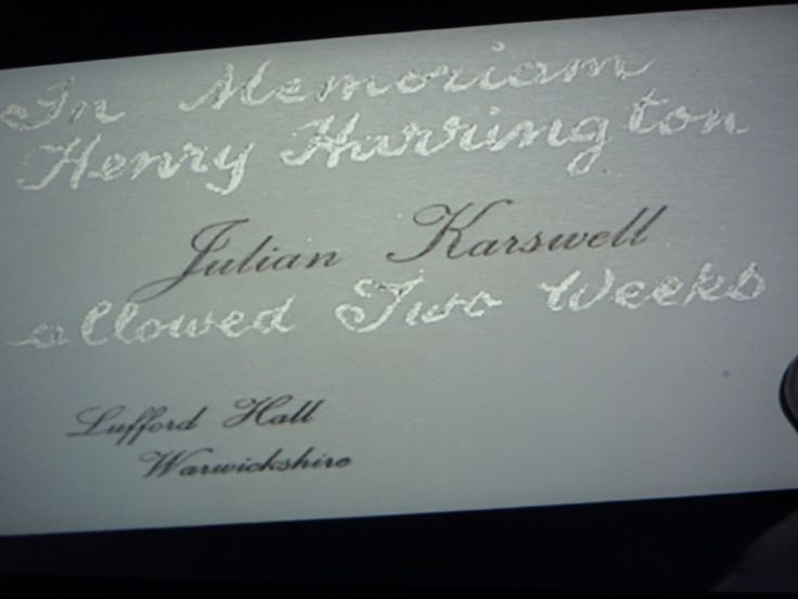 Business card of Julian Karswell. Handwritten on it is "In memoriam Henry Harrington. Allowed two weeks."