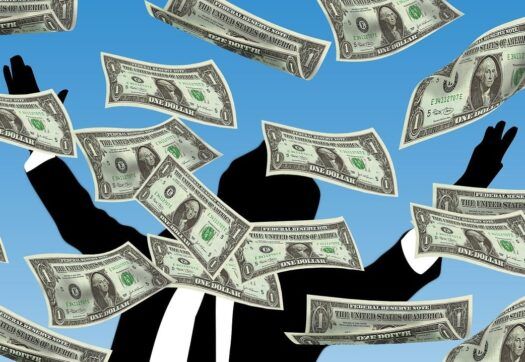 Clipart of US dollar bills falling from the sky. Silhouette of a man in the background.